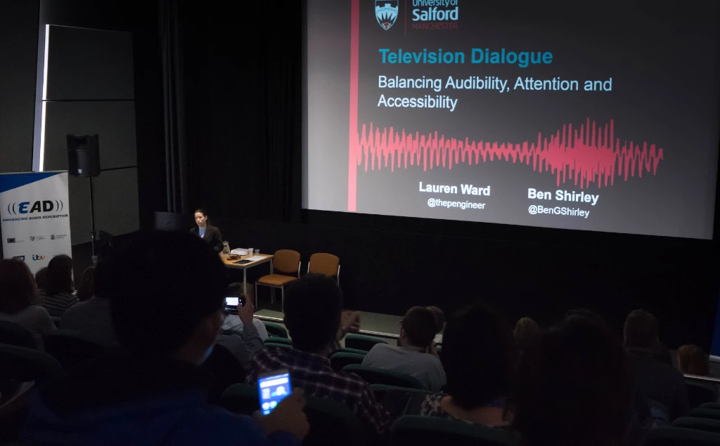 A photo of Lauren presenting at our conference.