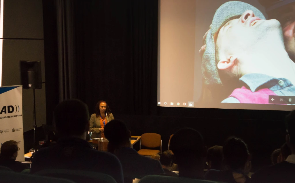 A photo of Maria presenting at our conference.