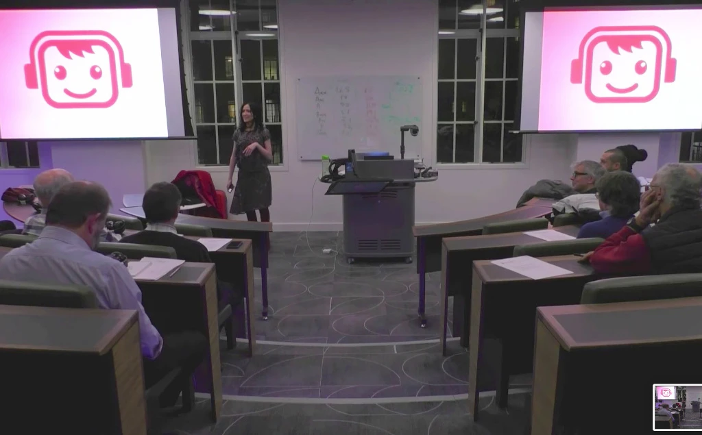 Photo of Mariana addressing an audience.