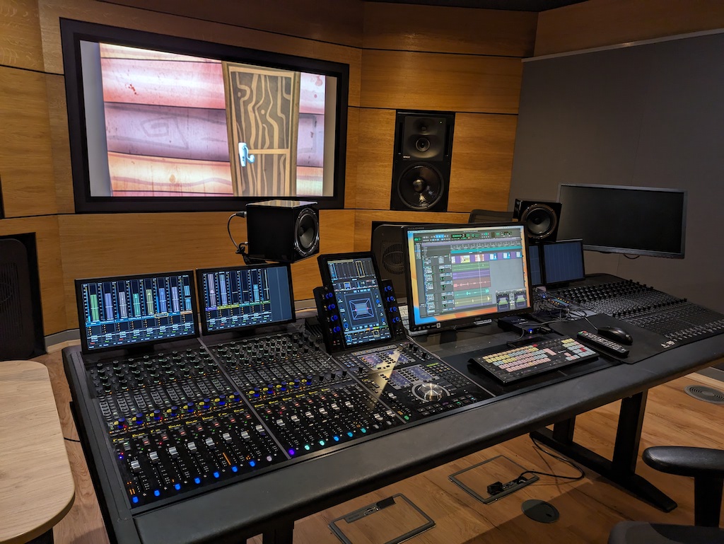 Dolby Studio with mixing desk and screen.