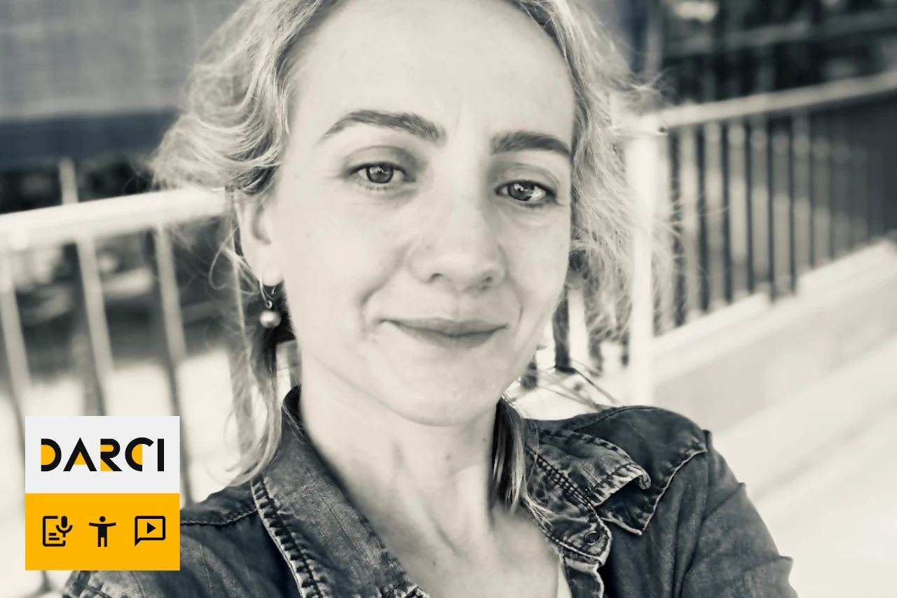 A grayscale photo of Monika in a denim jacket.