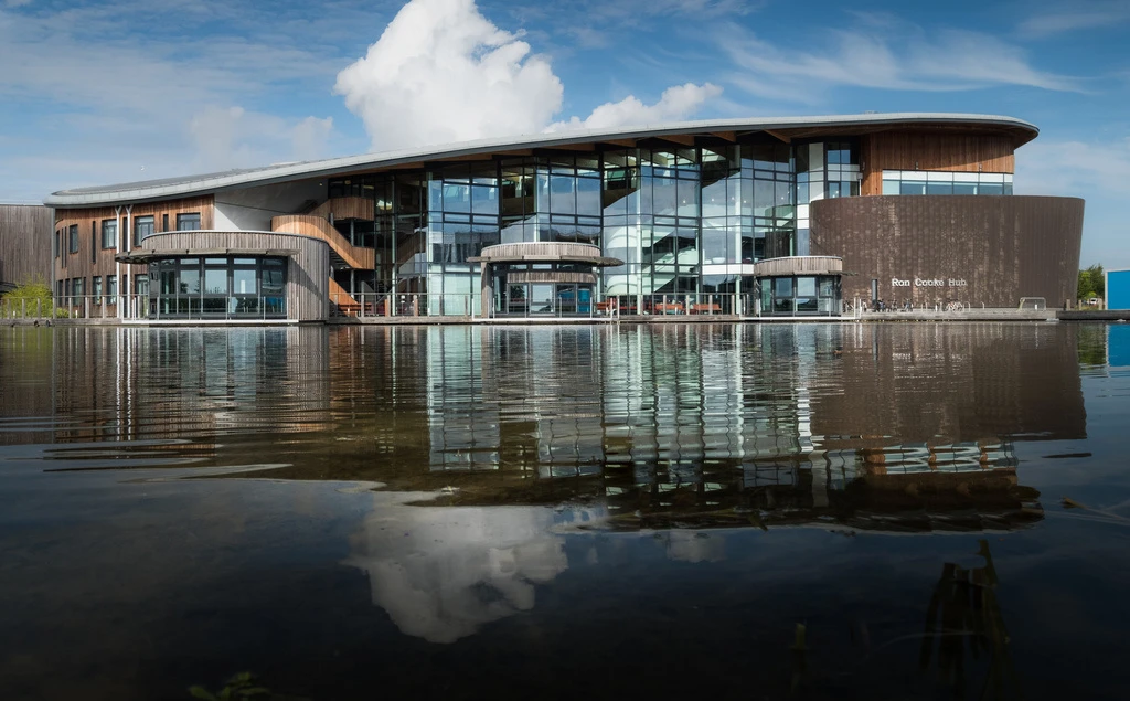 A photo of a building at the University of York next to a large pond.